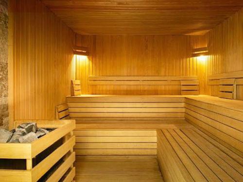 an empty sauna with wooden floors and wooden walls at Caesar Resort studio in Iskele