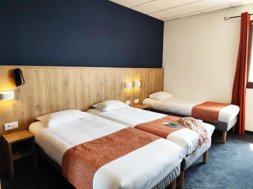 Postel nebo postele na pokoji v ubytování Hôtel Hélianthe