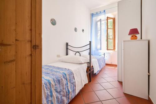 Ένα ή περισσότερα κρεβάτια σε δωμάτιο στο House Cesari