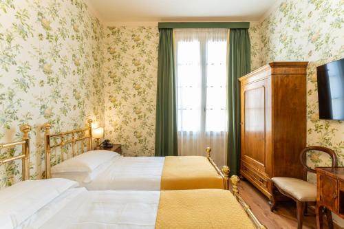 Postel nebo postele na pokoji v ubytování Hotel Pendini