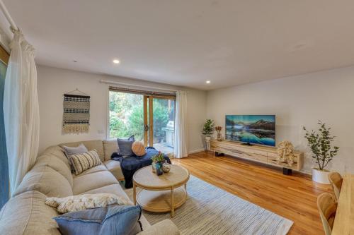 a living room with a couch and a table at Acacia Rise - The Ultimate Peninsula Getaway in Cape Schanck