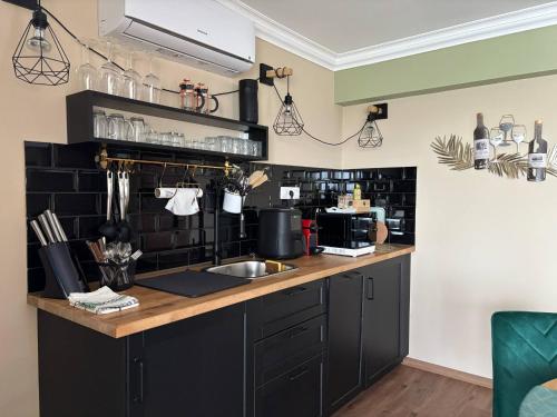 a kitchen with a sink and a counter top at RSD Riverside 
