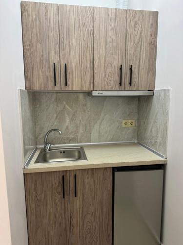 Η κουζίνα ή μικρή κουζίνα στο Lia Rooms