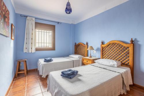 Postel nebo postele na pokoji v ubytování Villa El Regalo