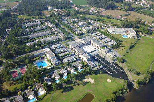 an aerial view of a resort with a golf course at 125 House - Swimming Pool, Tennis, Golf & Nature in Esposende