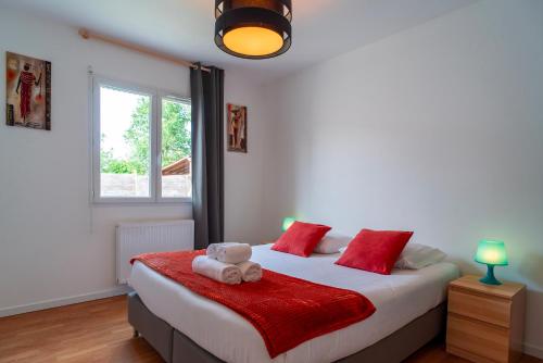 a bedroom with a bed with a teddy bear on it at La Bulle de Landrezac - Jacuzzi et Proche Plage in Sarzeau