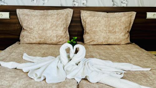 Postel nebo postele na pokoji v ubytování Hotel Eos