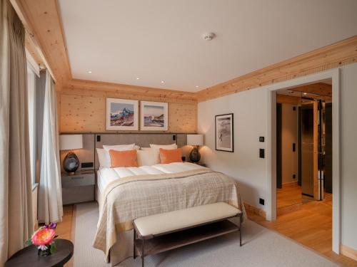 a bedroom with a large bed in a room at Kulm Hotel St. Moritz in St. Moritz