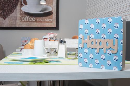 a table with a birthday cake on top of it at B&B Fantasie Romane in Rome