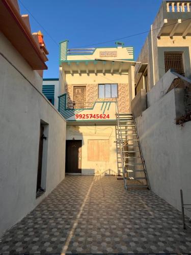 an empty street in front of a building at Mahek Home Stay Dwarka in Dwarka