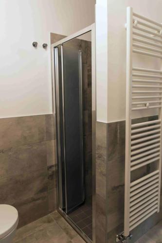 a shower with a glass door in a bathroom at rapisardi 8 in Riccione