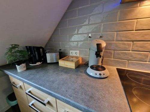 a kitchen counter with a blender on top of it at Modern Central Apartments near Hbf & Messe Essen in Essen