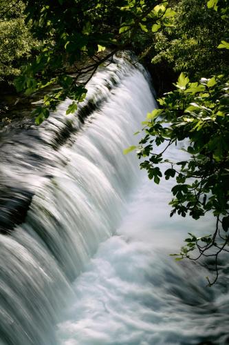 a close up of a waterfall in the jungle at Molino Del Santo in Benaoján