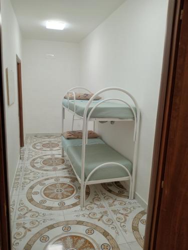 a room with a staircase with a tiled floor at Villa Pompei Oasis in Torre Annunziata