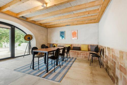 a dining room with a table and chairs at Gandum Village - Conscious Boutique Hotel in Montemor-o-Novo