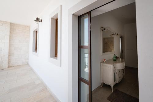 a bathroom with a sink and a mirror at Dimora Zezzella 