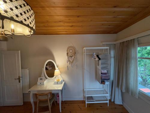 a room with a white desk and a mirror at Charming Anatolian House in Çengelköy in Istanbul