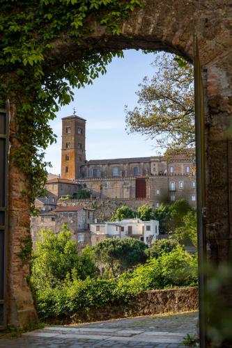 a view of a city through an archway at Radici Etrusche Sutri in Sutri