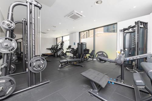 a gym with several treadmills and machines at The Metalworks in Bristol in Bristol