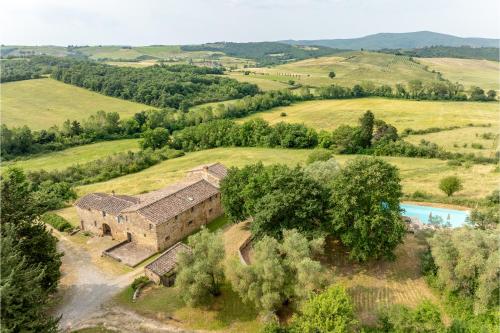 an aerial view of an old house in a field at In The Heart Of Chianti, Pool, Wifi, View - Lilliano in Castellina in Chianti