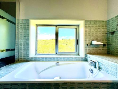 Postel nebo postele na pokoji v ubytování Le Cocon de La Bastide