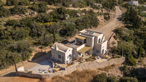 an aerial view of a house on a hill at Comodo Studios in Kythira