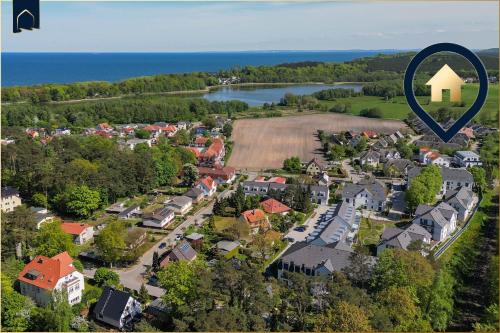 an aerial view of a small town with a house at FeWo Dock12C in Kolpinsee