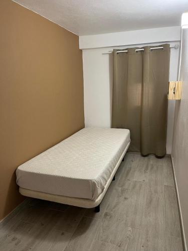 a small bedroom with a bed in the corner at Villa`s Safara in Safara