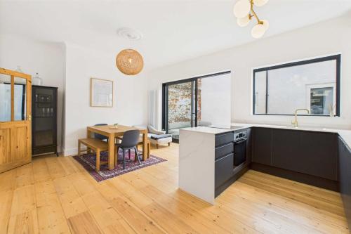 a kitchen with a sink and a table in a room at Host & Stay - Salty Place in Saltburn-by-the-Sea
