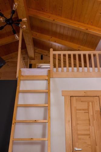 two bunk beds in a room with a ceiling at GomuL in Vorokhta