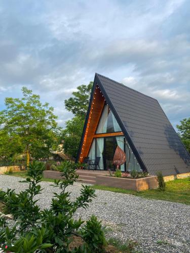a small house with a black roof at Chalet Martvili in Martvili