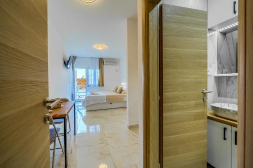 a room with a door leading to a bedroom at Villa LeMar in Baška Voda