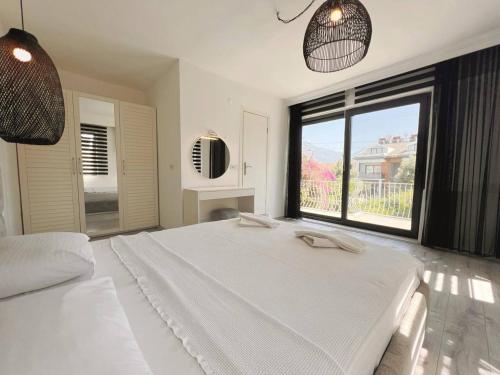 Postel nebo postele na pokoji v ubytování Burla Villa Çalış