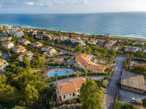 an aerial view of a resort next to the ocean at Residence Antigua in Bonifati
