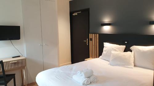 Katil atau katil-katil dalam bilik di Auberge anglefort