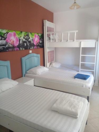 Postel nebo postele na pokoji v ubytování Ideal ApartHotel Saranda
