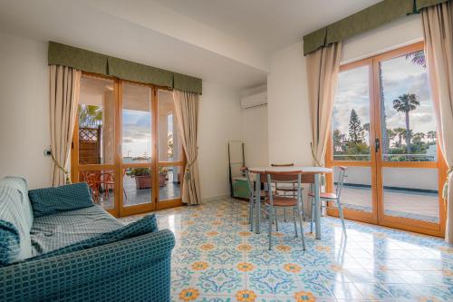 a living room with a couch and a table at Residence Antigua in Bonifati