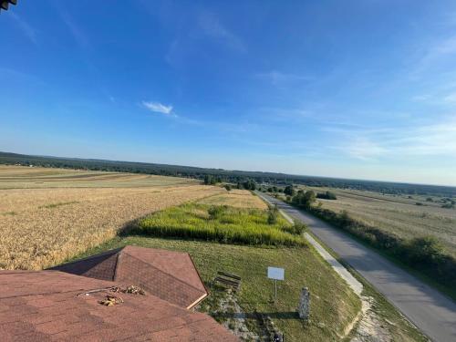 an aerial view of a field and a road at Sopocka Przystań - Domek Letniskowy in Ciotusza Stara