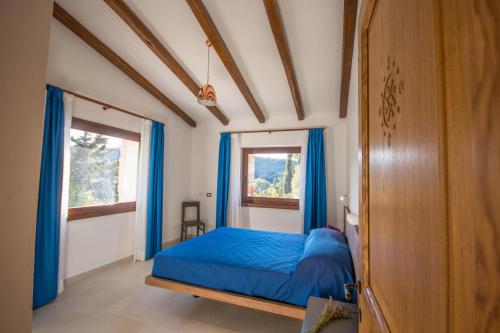 En eller flere senge i et værelse på Corbezzolo Villa Capelvenere