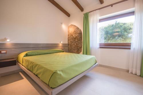 En eller flere senge i et værelse på Ginepro Villa Capelvenere