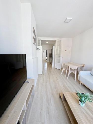 a living room with a couch and a table at Élégant appartement une chambre in Brussels