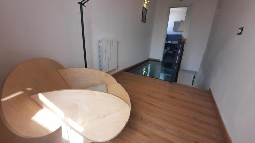 a room with a wooden table and a chair at Oltre i Canti in Palermo