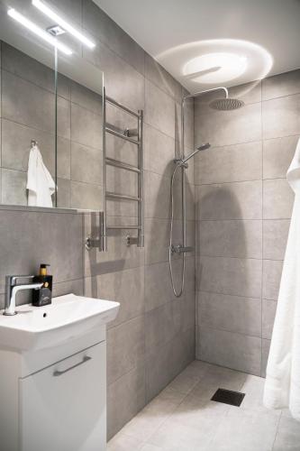 a bathroom with a sink and a shower at Mörrum River Residences in Mörrum