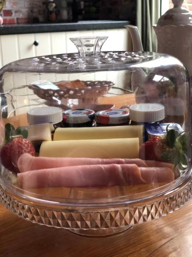 a tray of different types of food on a table at Slapen bij de Brug in Zuidveld