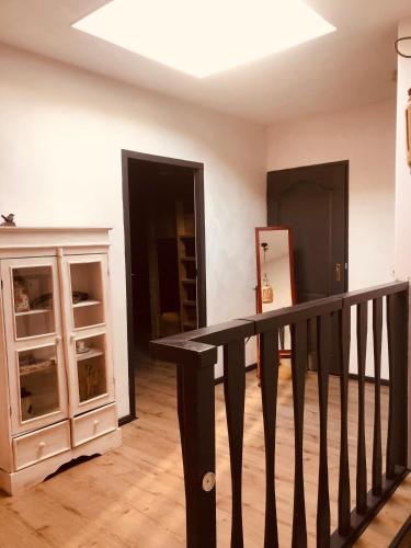 a room with a stair railing and a closet at Slapen bij de Brug in Zuidveld