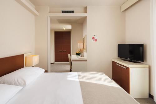 Hotel Albatros Plava Lagunaにあるベッド