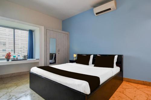 Postel nebo postele na pokoji v ubytování Super Hotel O Dumduma Near DN Regalia Mall