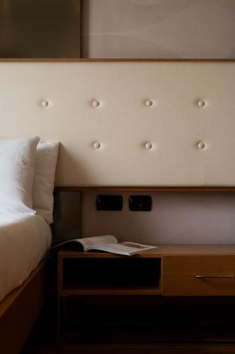 Axolute Comfort Hotel Como Cantùにあるベッド