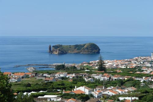 a view of a town and a island in the water at Quinta dos Curubas in Vila Franca do Campo