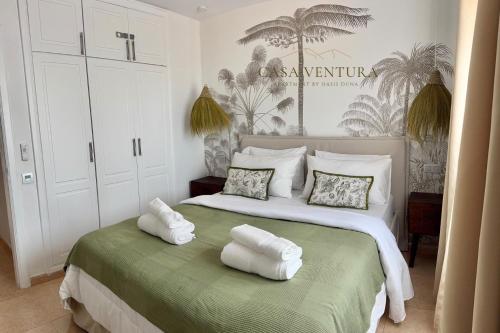 Postel nebo postele na pokoji v ubytování B-Rent Suite Casa Ventura